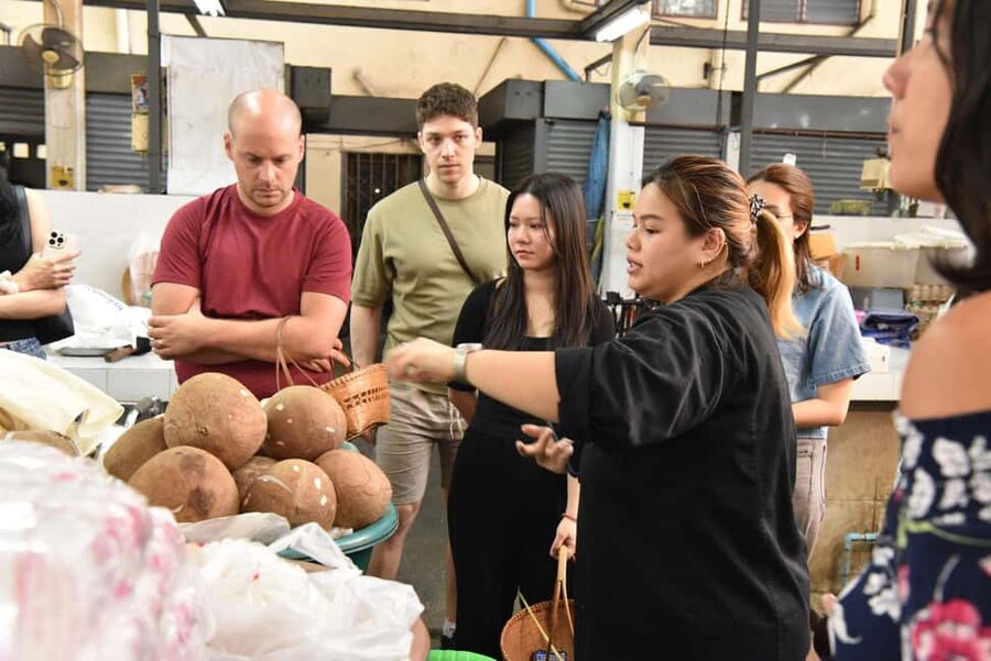 Bangkok: Hands-on Thai Cooking Class & Market Tour in Sathon - Entering The Kitchen Behind Suan Phlu Market