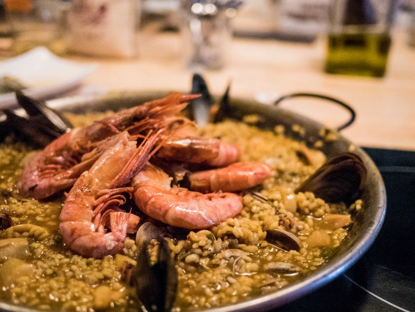 Barcelona: Paella Cooking Workshop and Market Tour - Unlimited wine, beer, and soft drinks: good fun with a real meal