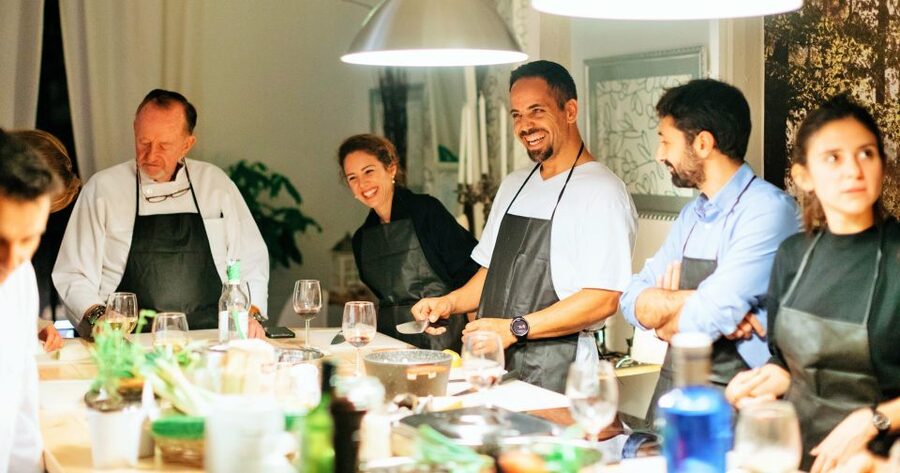 Barcelona: Paella Cooking Workshop and Market Tour - Group dynamics and pace: small teams, all roles, and rotation