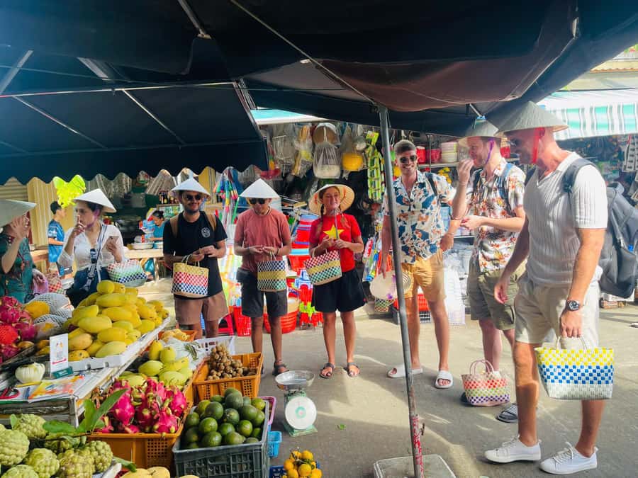 Hoi An: Basket Boat with Lantern-Making & Cooking Class Tour - Hotel pickup, market stop, and choosing ingredients like a local