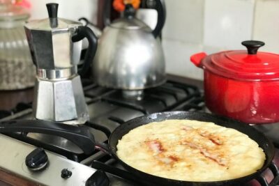 Private Dutch Pancake Cooking Class in an Amsterdam Canal Home - Lunch at the table with two glasses of Dutch wine
