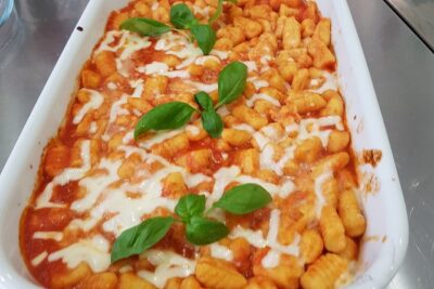 Private Gnocchi Cooking Class with Professional Chef in Padova - The sauce step: tomato, basil, and that garlic moment