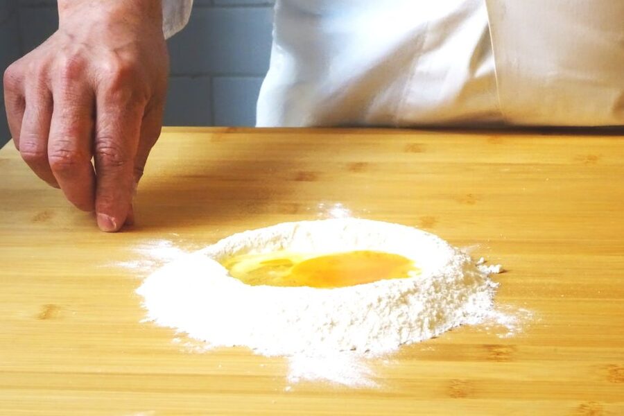 Rome: Pasta Cooking Class in a Professional Pasta Laboratory - At the table: finishing the meal you built yourself
