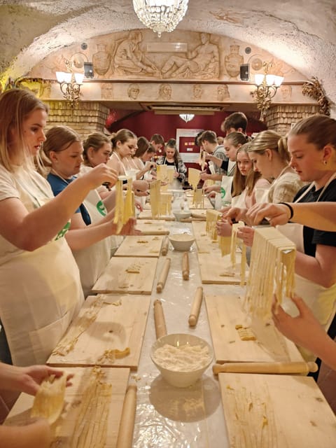 Rome: Pasta & Tiramisu Cooking Class near the Spanish Steps - Inside Trattoria Amici: The Room, the Art, and How the Evening Starts