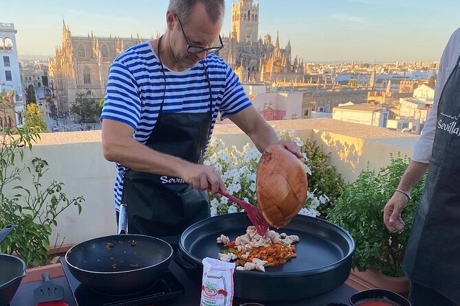Sevilla: Rooftop Paella Cooking Class & 30-minute expert Q&A - The paella feast: eat what you cooked
