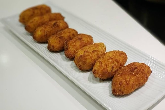 Spanish Tapas & Paella Cooking Class in Central Madrid with Lola - Eating What You Made: Beer, Wine, and a Proper Sit-Down