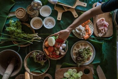 The Namkhan - Cooking Class - Harvesting veggies in the organic gardens and greenhouses