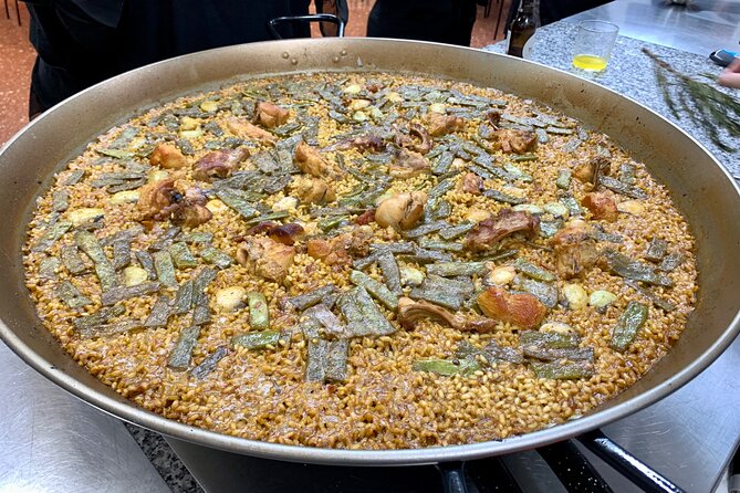 Valencian paella cooking class, tapas and visit to Ruzafa market. - Tapas, sangria workshop, and the pre-cooking food reality